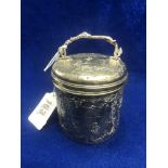 A silver lidded pot with handle,