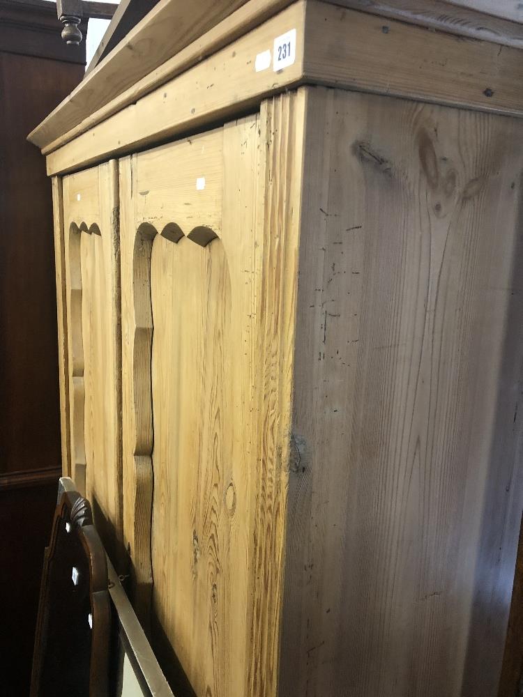 A 19th century pine double wardrobe.