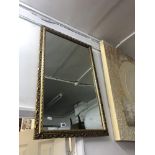 A gilt framed mirror