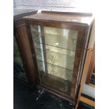 A Walnut single door display cabinet