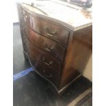 A mahogany serpentine front chest of drawers