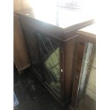 Glass fronted bookcase, with key a.