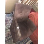 A small brown suede fireside chair