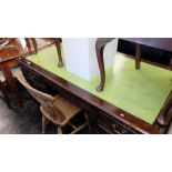 A large mahogany leather top desk