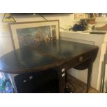 A mahogany and leather top table