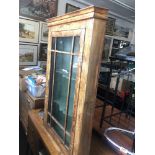 A walnut corner cabinet