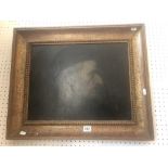 A framed 19th century oil painting of a monk
