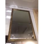 A gilt framed mirror