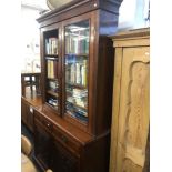 A Victorian walnut bookcase on cupboard base