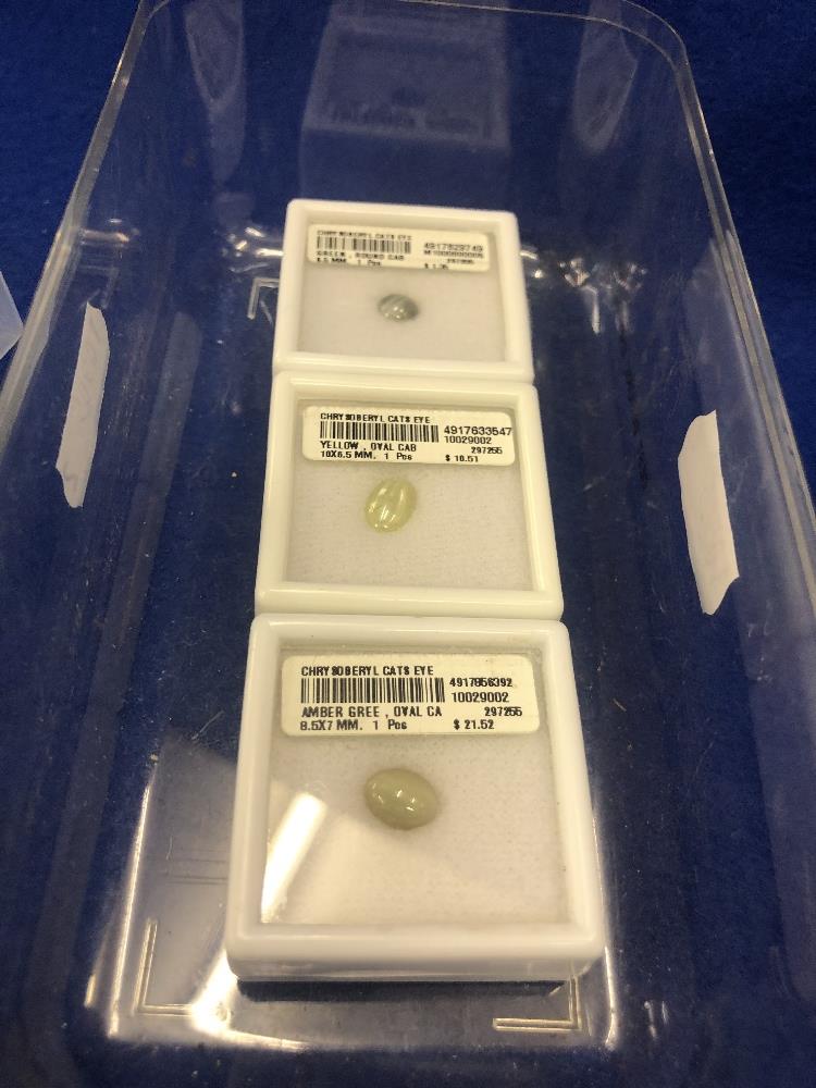 Three boxes of Chrysoberyl (cats eyes)