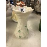A small Belleek clover vase