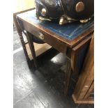 A leather top drop flap table