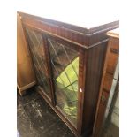 Glass fronted bookcase, with key a.