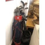 A qty of golf clubs and a trolley