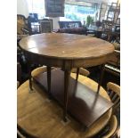 A mahogany extending dining table with two leaves