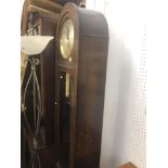 An oak long case clock