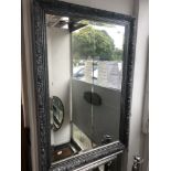 A silver framed mirror