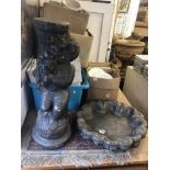 A stone bird bath