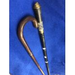 An Indian sword stick plus another walking stick