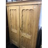 A 19th century pine double wardrobe.