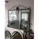 A mirror in an iron frame
