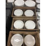 A large qty of white plates