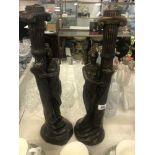 A pair of art deco style figural candle sticks