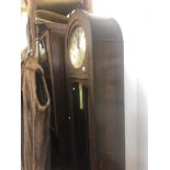 An oak long case clock