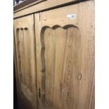 A 19th century pine double wardrobe.