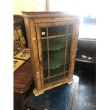 A walnut corner cabinet