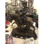 A bronze huntsman on a horse