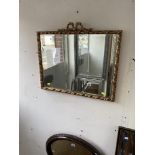 A gilt framed mirror