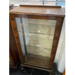 A Walnut single door display cabinet