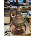 A Persian copper jug and tray