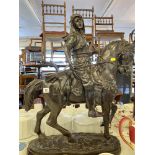 A bronze of a man on horse