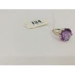 An 18ct white gold, ladies single stone Amethyst with diamond centre, Amethyst approx.