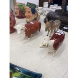 A Beswick donkey and Two Beswick bulls