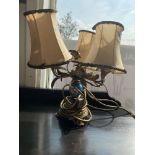 A brass and porcelain table lamp