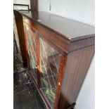 Glass fronted bookcase, with key a.