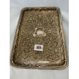 A silver embossed tray,