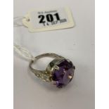 An 18ct white gold, ladies single stone Amethyst with diamond centre, Amethyst approx.