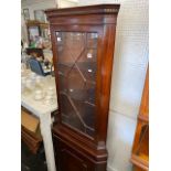 A mahogany corner cabinet