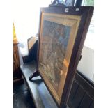 An oak framed needlework fire screen