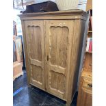 A 19th century pine double wardrobe.