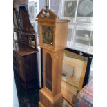 A pine cased modern clock,