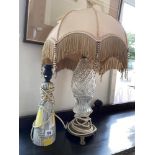 A glass and brass lamp plus another