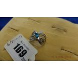 A platinum diamond and blue topaz ring, size O,