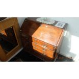 A mahogany bureau four drawers under