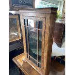 A walnut corner cabinet