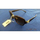 A pair of vintage tortoiseshell sunglasses by Coach